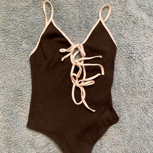 Urban outfitter 3 tie black and white body suit. Size S